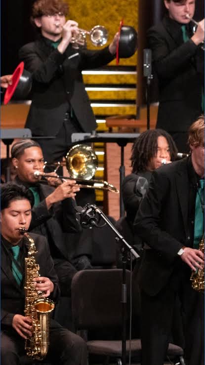 Jazz band brass and saxophone musicians performing
